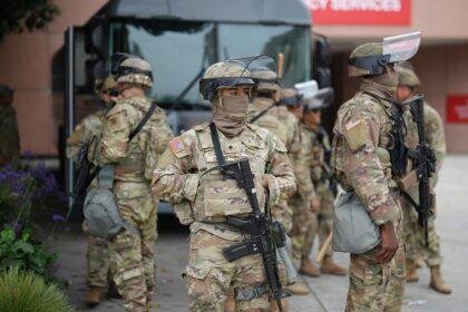 U.S. National Guard walking by vehicle
