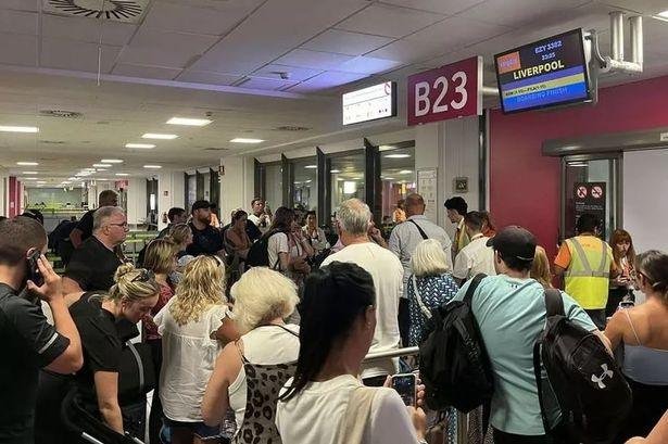 Passengers at a gate in Malaga Airport