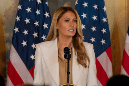 First Lady Melania Trump speaking at a podium