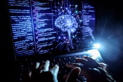 A person works at a computer with an illustrative image generated by artificial intelligence on the screen, showing code from various programming languages and a neural network diagram.