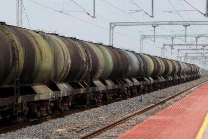A oil tanker train moves near a railway station on the outskirts of Ahmedabad, India. (REUTERS)