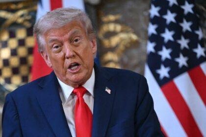 Donald Trump speaking at a press conference.