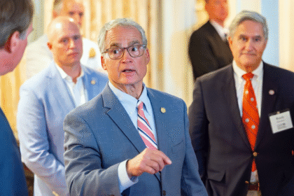 Geary Higgins of Virginia stands with people at political event