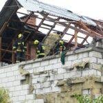 Polish firefighters inspect a house that was damaged by numerous Russian drone strikes in Wyryki.