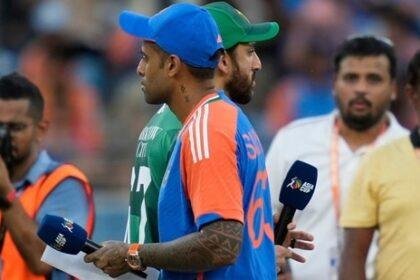 Pakistan's captain Salman Agha, rear, walks past India's captain Suryakumar Yadav after the coin toss ahead of the Asia Cup cricket match (AP)