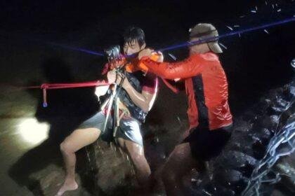 A river rescue in Salcedo in the Philippines. Pic: Philippines Coast Guard/AP