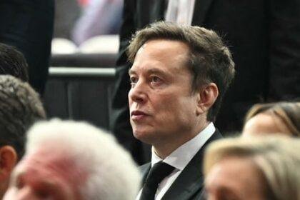 Tesla CEO Elon Musk attends the public memorial service for right-wing activist Charlie Kirk at State Farm Stadium.(AFP)
