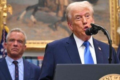 US President Donald Trump (R), alongside Secretary of Health and Human Services Robert F. Kennedy Jr. (L), speaks about autism in the Roosevelt Room of the White House in Washington, DC (AFP)