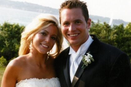 George and Jennifer Hagel smith on their wedding day