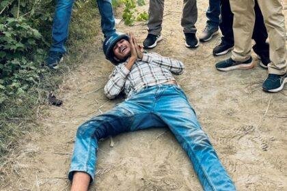 Security personnel with one of the five shooters allegedly involved in the firing at Bollywood actor Disha Patani's ancestral house, who was arrested along with an associate after an encounter, in Bareilly, UP. (PTI)
