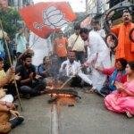 BJP activists protest against the attack on MP Khagen Murmu and MLA Shankar Ghosh during their visit to the flood-hit Doars Nagrakata area in Kolkata.(ANI)