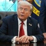 President Donald Trump speaks to reporters in the Oval Office.