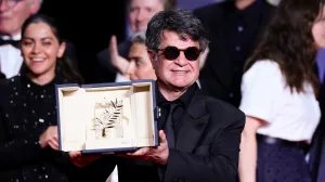 Jafar Panahi accepts the Palme d’Or Award for 'It Was Just an Accident' onstage during the closing ceremony at the 78th annual Cannes Film Festival.