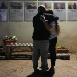 People attend a memorial service in Kibbutz Kfar Aza, where many community members were killed and abducted in the 2023 Hamas attack.