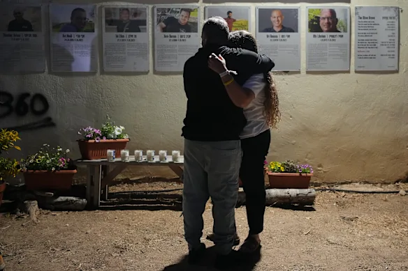 People attend a memorial service in Kibbutz Kfar Aza, where many community members were killed and abducted in the 2023 Hamas attack.
