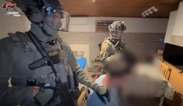 Armed cops at the property of Leonardo Gesualdo