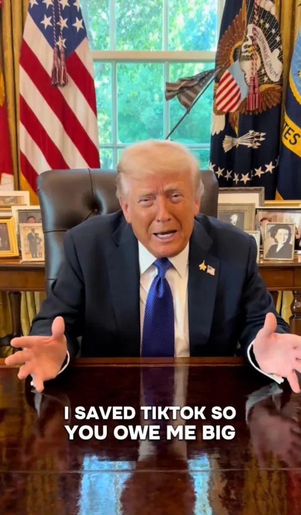 Donald Trump with open hands behind a desk, with text that reads "I SAVED TIKTOK SO YOU OWE ME BIG".