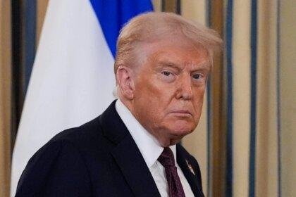 President Donald Trump arrives for a news conference.