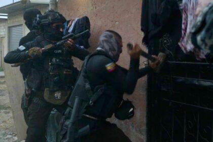 Officers force their way into home on a raid
